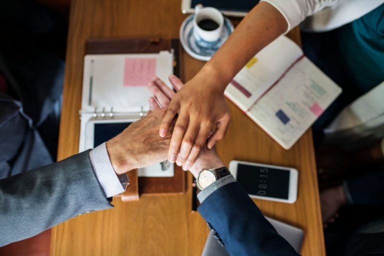 team-business-people-stacking-hands