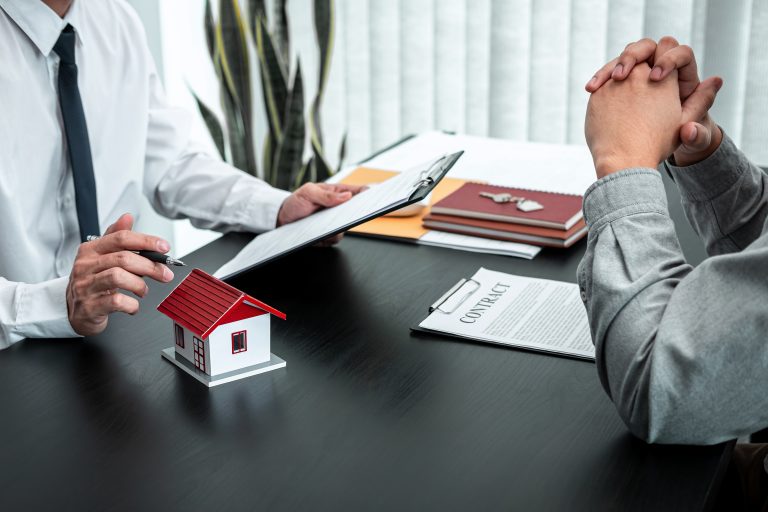 Estate agent are presenting home loan to client and discussing t