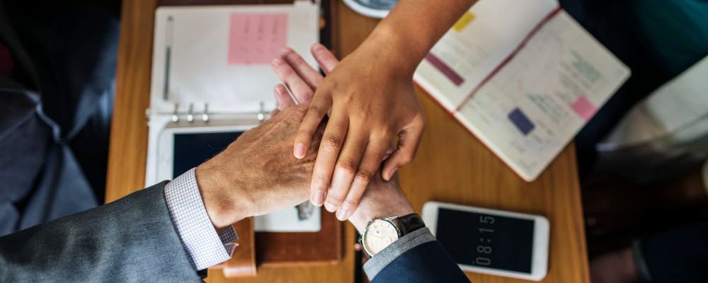 team-business-people-stacking-hands